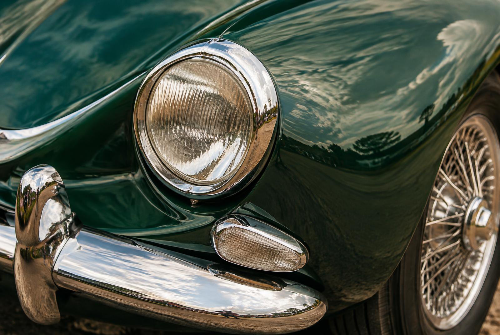 Chrome headlamp on green bodywork